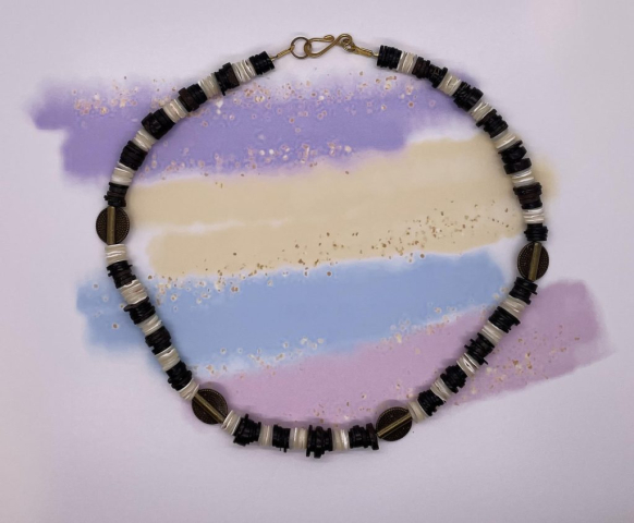 Unisex Choker- Ocean Shell Beads. Coconut Heishi Beads. Gold Metal Carved Discs. Approx. length: 19 1/2 inches. Pronounced: THEE-beh Origin: Basotho Meaning: Shield