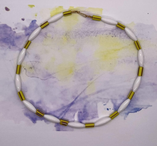 Unisex Choker- Yellow Striped Tube Venetian Beads. White Acrylic Long Tube Beads. Approx. length: 16 inches. Pronounced: OO-zo-mah Origin: Ibo Meaning: The Right Way