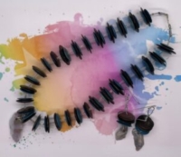 Choker Set- Black Bone Disc. Blue Bone Disc. Translucent Silver Bugle Beads. Polished Natural Stone Centerpiece. Approx. length: 17 inches. Earrings to Match 3 inches. .925 Sterling Silver Earwire. Pronounced: ah-deh-REEN-reh Origin: Yoruba Meaning: Crown Arrives Gracefully