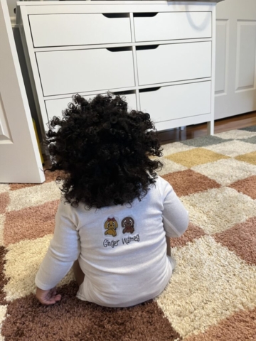 “All of the baby t-shirts feature the Ginger and Nutmeg brand name design painted on them."
