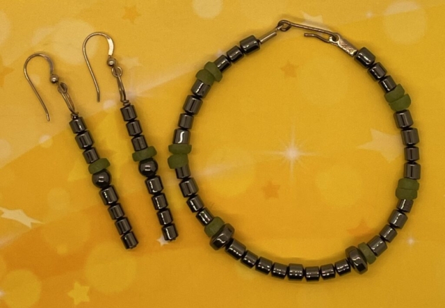 Wrist Bracelet- Hematite Tube Beads. Jade Rondelle Beads. Hematite Rondelle Beads. Approx. length: 8 1/2" Earrings to Match. Hematite Tube Beads. Jade Rondelle Beads. Hematite Round Beads. Approx. length: 2 1/2 inches. .925 Sterling Silver Earwire. Pronounced: OH-be-ah-gel-lee Origin: Ibo Meaning: "Came To Enjoy"