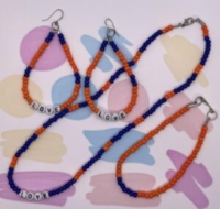 Choker Set and Ankle Bracelet. Blue and Orange Pony Beaded Choker. Acrylic Alphabet Beads. Approx. length: 9 3/4 inches. Earrings to Match 4 1/4 inches. .925 Sterling Silver Earwire. Pronounced: REW-do Origin: Shona Meaning: Love