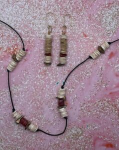 Necklace Set- Knotted Leather Strung. Ocean Shell Beads. Acrylic Gold Tone Painted Gem Chips. Four Sided Acrylic Stone Accents. - Approx. length: 24 inches. - 2 1/2 inch Earrings to Match. - White and Beige Ocean Shell Beads. Acrylic Stone Accent Chips. Acrylic Gold Tone Painted Gem Chips. 14K Gold Filled Earwire. Pronounced: eh-REE. Origin: Yoruba. Meaning: One Full of History