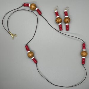 Necklace Set- Pinewood Round Beads. White Rondelle Clay Beads. Red Disc Glass Beads. Leather Strung. Approx. length: 34 inches. Hand Shaped 14K Gold Filled Earwire. Approx. length: 2 3/4 inches. Pronounced: HAH-LEE-MAH. Origin: Africa. Meaning: Kind and Patient