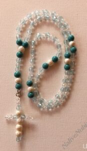 Rosary. Frosted White and Turquoise- Turquoise Acrylic Beads. Acrylic Frosted Beads. Turquoise Faceted Crystal Beads. Clear Crystal Czech Bicone Beads. Approx. length: 17 inches.
